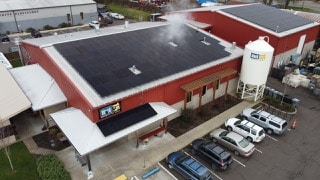 commercial building with solar panels on roof